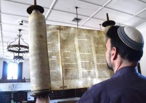 Rabbi David Ross Senter of the Temple Israel in Portsmouth, shows a Holocaust Torah on permanent loan from the Memorial Scrolls Trust in London, England. It is one of 1,564 Czech Memorial Scrolls that survived World War II.