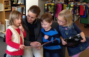 woman reading to children