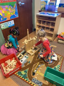 girls playing with blocks preschool